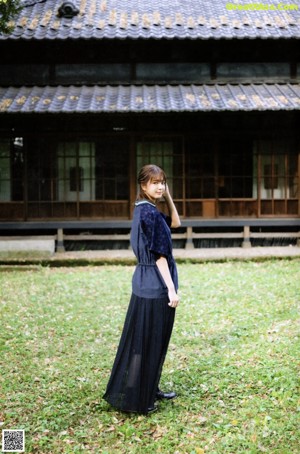 a magazine page with a picture of a woman in a blue dress