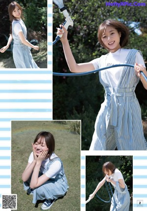 A woman in a blue and white striped dress posing for a magazine.