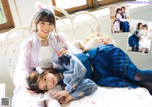 A group of girls sitting on top of a couch.