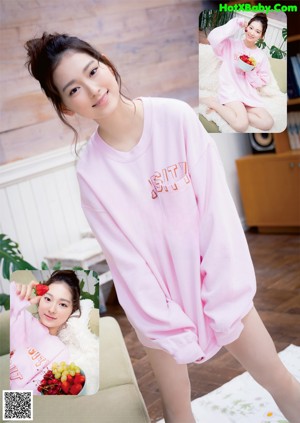 A woman in a blue polka dot dress posing for a magazine.